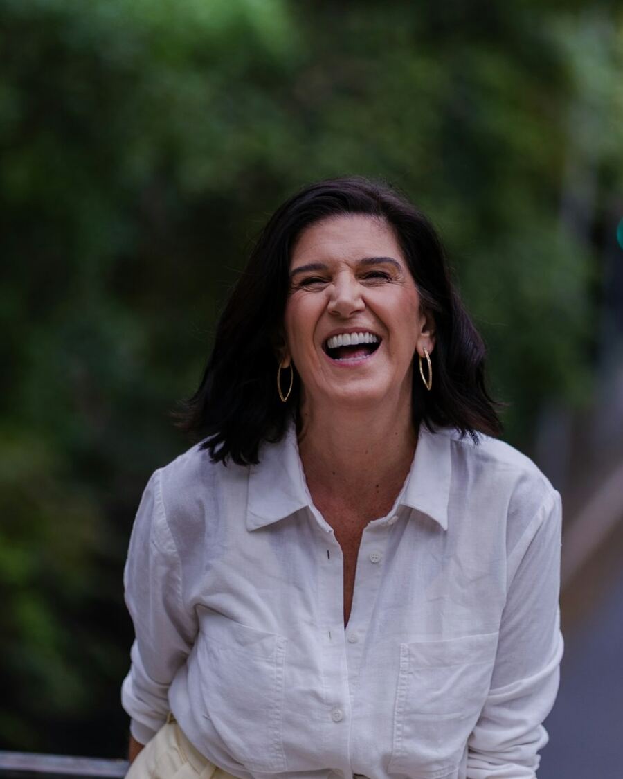 Sarah Ellison laughing on a bridge near her office