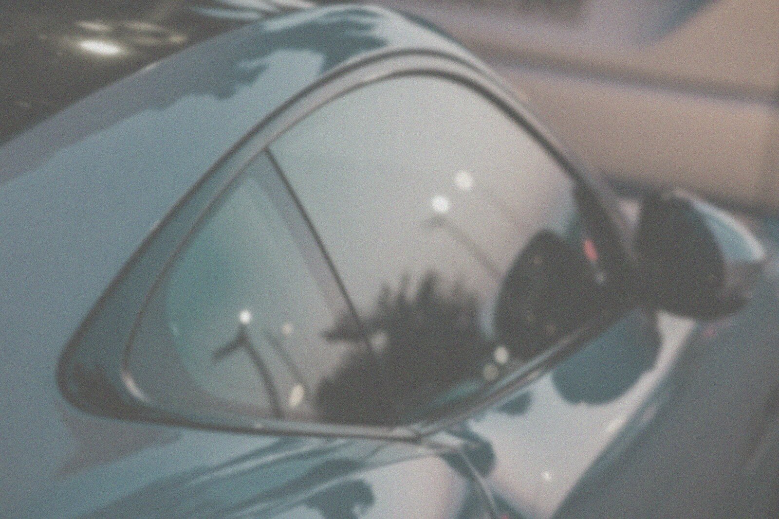 The same demo photograph graded flat and hazy to stand in for unpolished paint