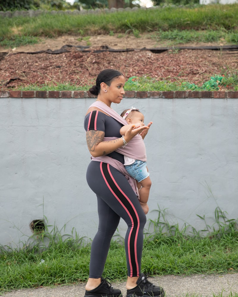 A parent with her baby on the studio floor between sets